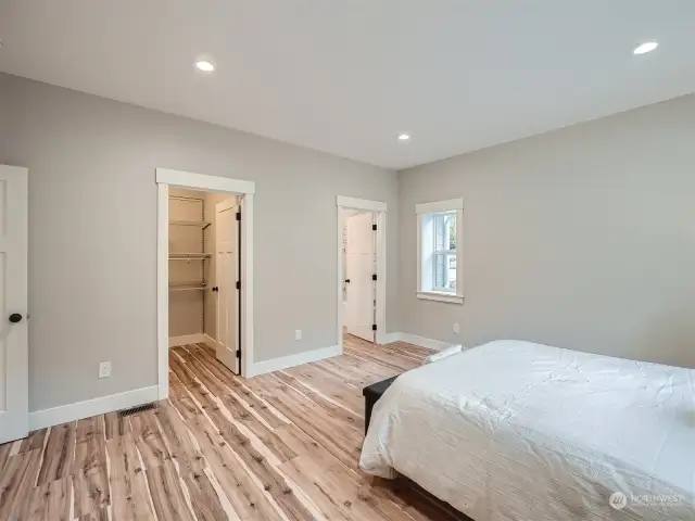 Primary bedroom with walk-in closet and ensuite bathroom