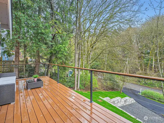 Deck overlooks nature, inviting you to relax.