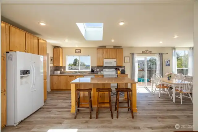 Spacious kitchen with island and seating.