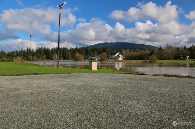 Looking from the Marina area parking lot across the lake from the property looking towards the property's lakefront. Overhead lights run all along the West side of the lake to enjoy nighttime watersports.