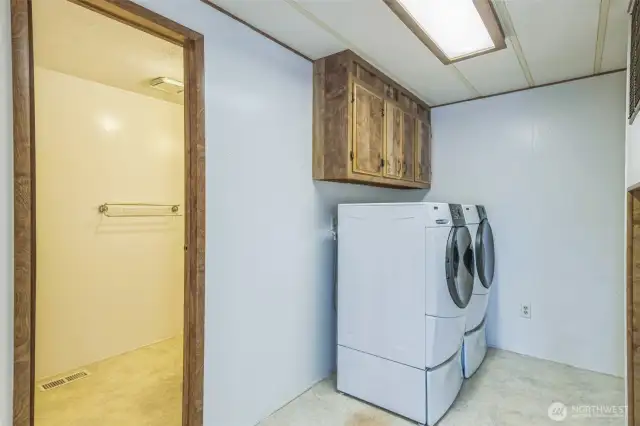 Newer set of very nice Kenmore Elite HE washer and dryer set on pedestals. Both included in the sale. Full bath on the left.