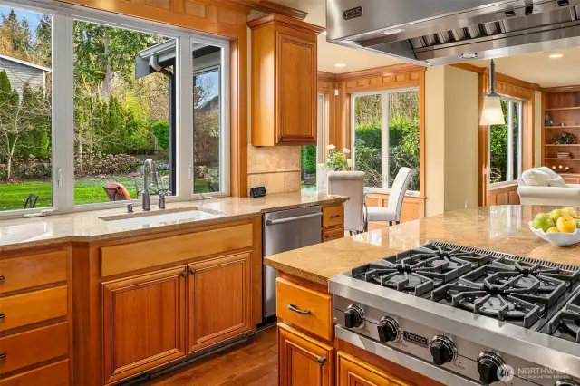The Chef's kitchen ~ massive granite seating/prep island, SubZero refrigerator, a full Viking appliance package including double ovens, warming drawer, and a commercial-grade 6-burner range and vent hood, along with abundant cabinet and countertop space.