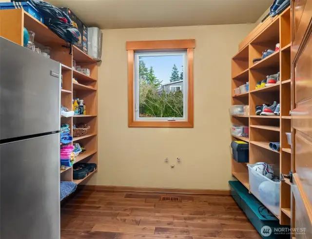 Two pantries include a walk-in food pantry and this large utility/surplus room.