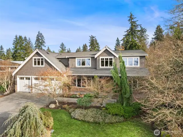 Smartly sited on a quiet Houghton street is this majestic, quality-built custom Craftsman adjacent to Kirkland's Watershed Park. A rare, flat, huge, kickball-sized 15,000 SF private lot, and great outdoor space.