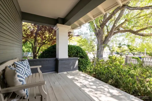 Covered porch invites  you to sit and watch the world go by....