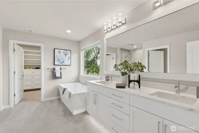 top floor primary suite provides lots of natural light!  Primary bath with dual sinks, soaking tub and tiled walk-in shower. Built in closet is beyond.   For representation purposes only colors may vary.