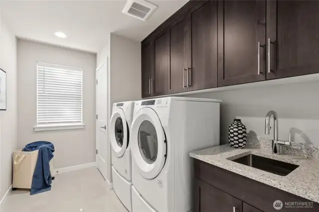 Laundry room connects to primary suite. For representation purposes only colors may vary.
