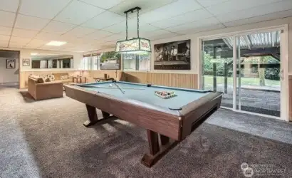 Downstairs Great additional living space, Media Room, Gym and Living space! Multi-generational living or rental space with it's own separate entry door in background.