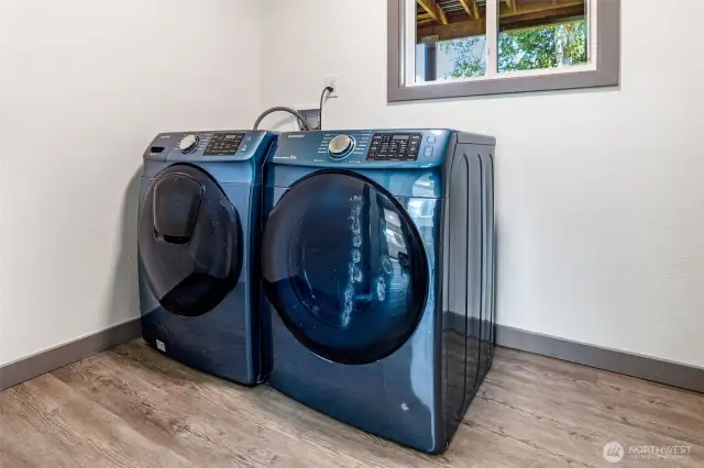Separate laundry area downstairs