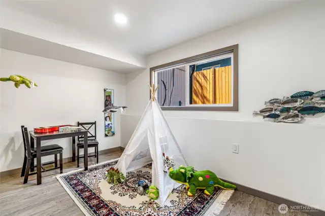 Playroom/office/bedroom has closet and window.