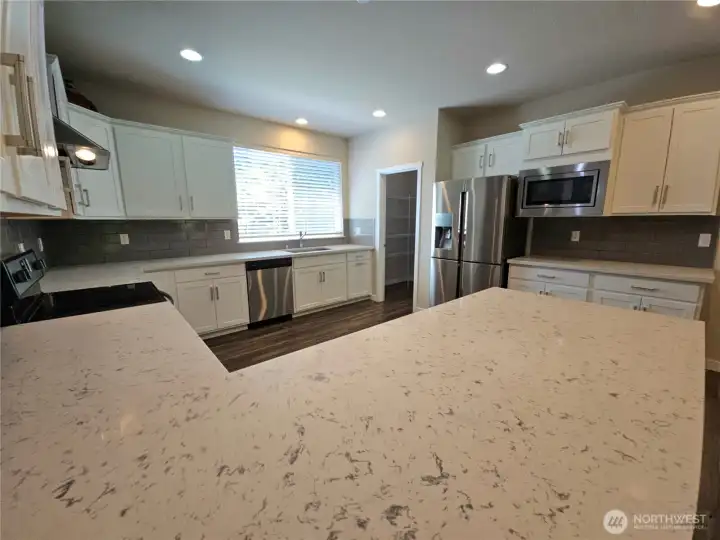Tons of counter space and SS appliances.
