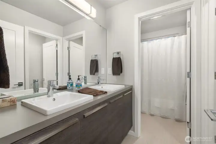 Well appointed hallway bathroom thoughtfully positioned to serve additional guest rooms