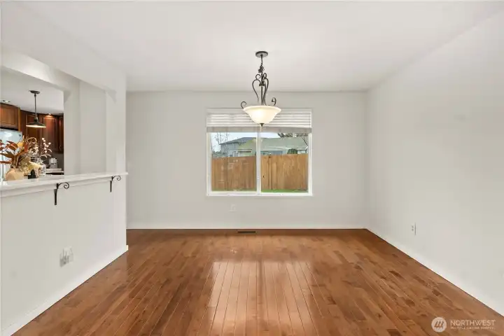 Kitchen + Dining Harmony – Bar area bridges spaces for easy entertaining.