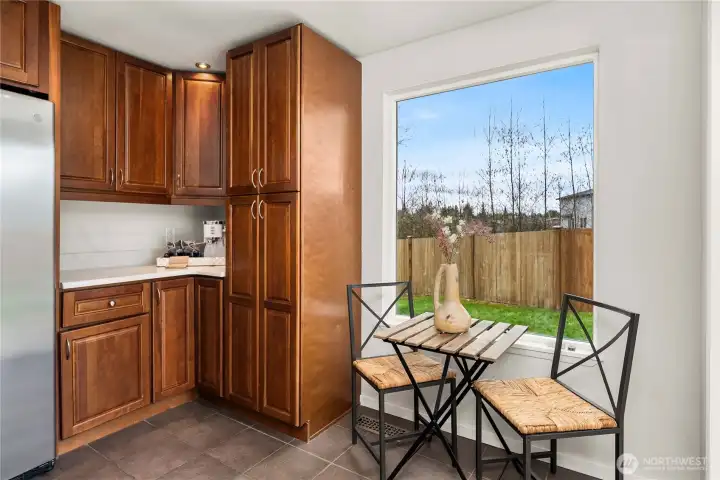 Large window offers natural light and a cozy eat-in area
