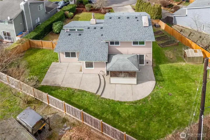 Fenced yard with large patio, garden, greenhouse, and endless possibilities