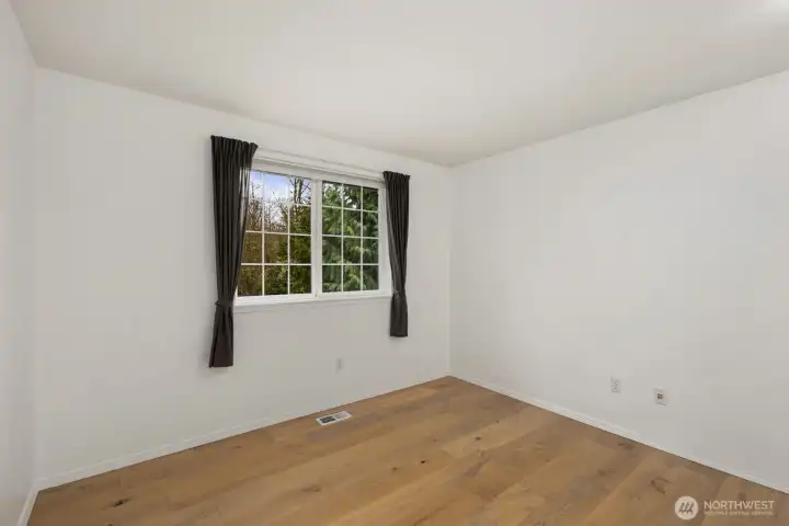 Warm, inviting with oak plank floors