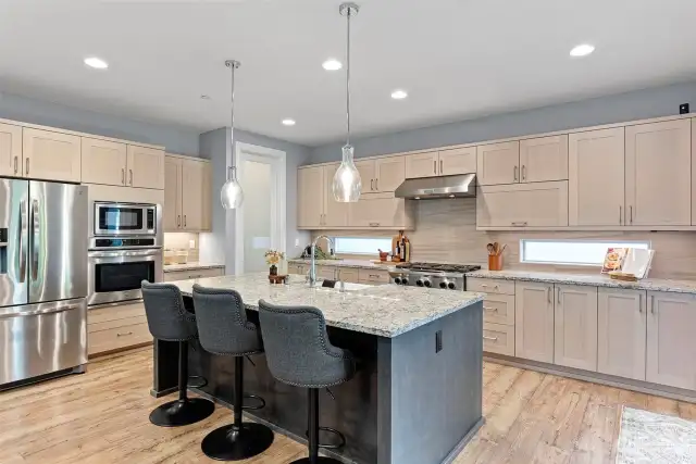 Huge island, granite counter tops, soft close cabinets make this kitchen stand out.