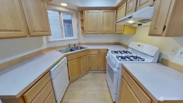 Well appointed kitchen with current appliances, gas cooking and proper venting.  1998 construction standards