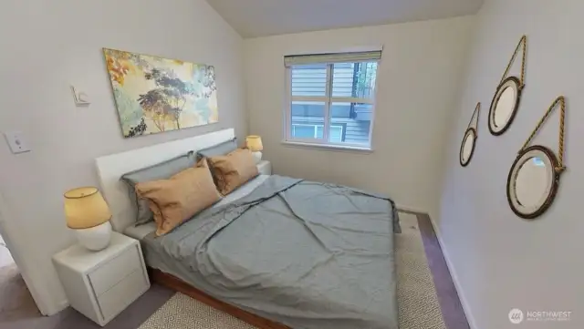 Second bedroom as shown from this earlier staged photo.