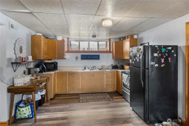 functional kitchen with sleek finishes, ample space, and a welcoming atmosphere—perfect for cooking