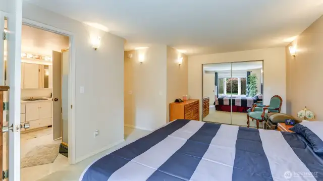 Adjoining bathroom with jetted soaking tub and separate shower