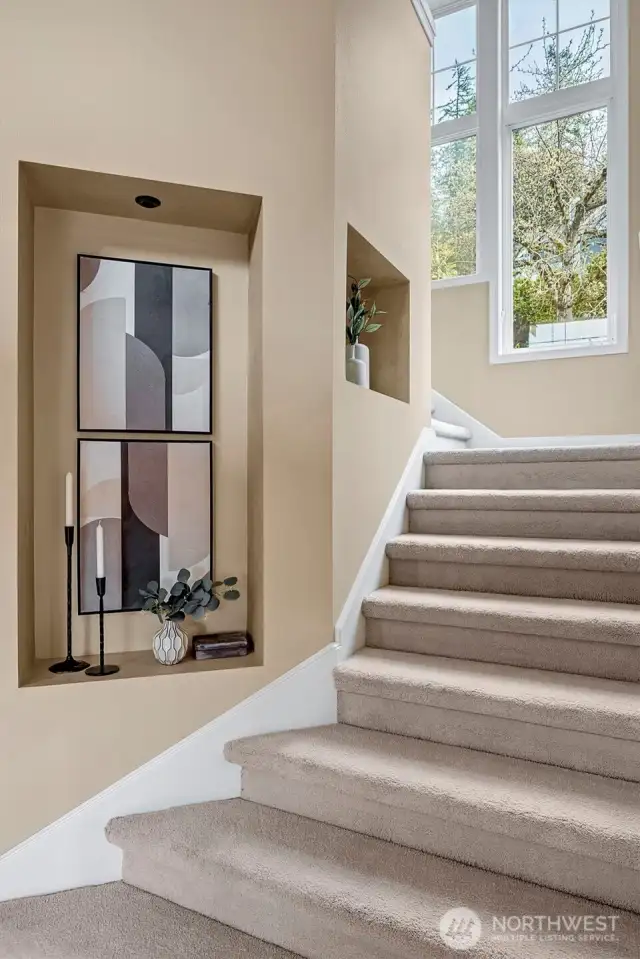 This home features double stairways - one to the Primary suite and one to the 3 bedroom and bonus room North wing or children's wing.