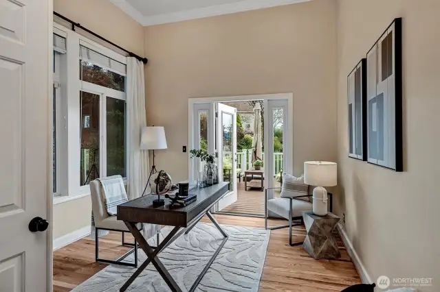 Main floor office with closet and access to the sun-filled deck