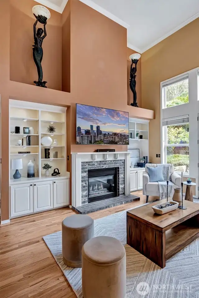 Two story, light filled family room, graced with a fireplace and built-ins.  French doors to the backyard.