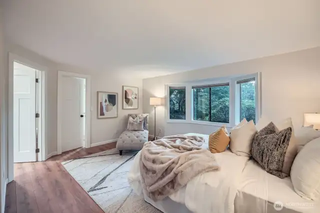 Primary suite with its ensuite bath and walk in closet