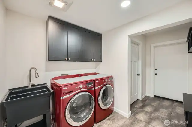 Lovely utility room with those fun red appliances