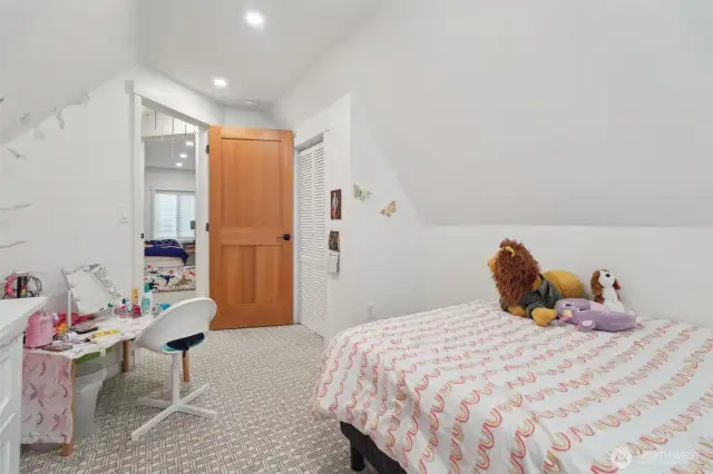One of two second floor bedrooms