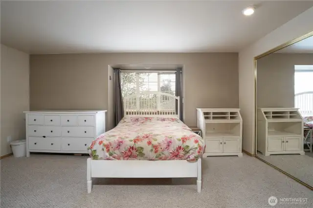 King-size primary bedroom has enough space for larger furniture.