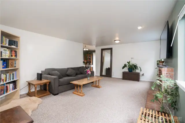 The living room offers a lovely blend of contemporary comfort & classic warmth.