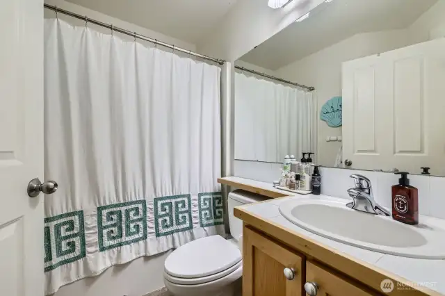 Full bath for the 2 upper bedrooms. w/ tub-shower combo.