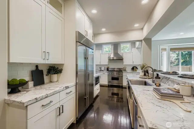 Chef's Kitchen With Dual Prep Areas, Slab Counters & Stainless Steel Appliances