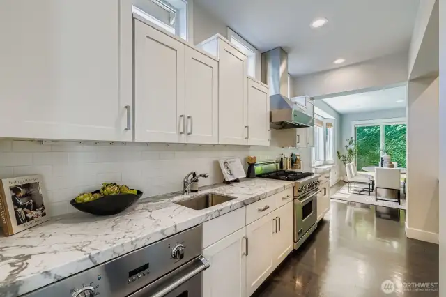 Chef's Kitchen With Dual Prep Areas, Slab Counters & Stainless Steel Appliances