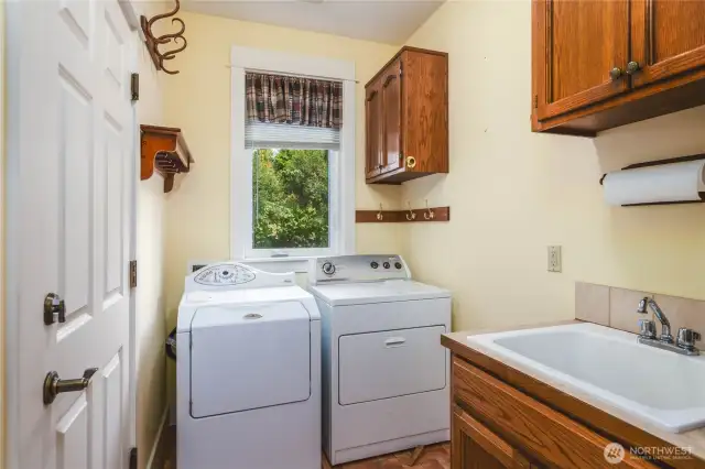 Laundry room on the main level with utility sink.