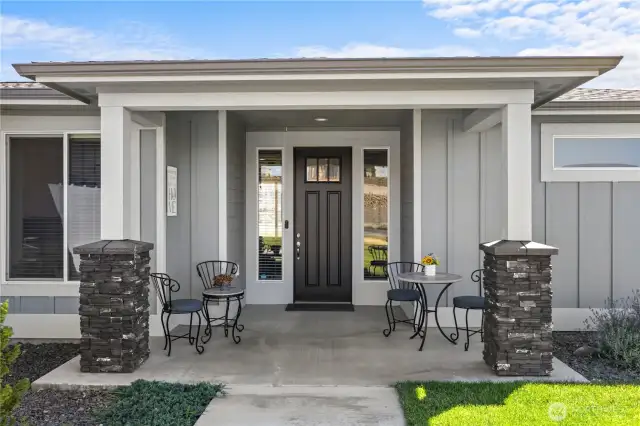 Welcoming front porch! Also provides a cool  respite from afternoon sun in late  summertime.