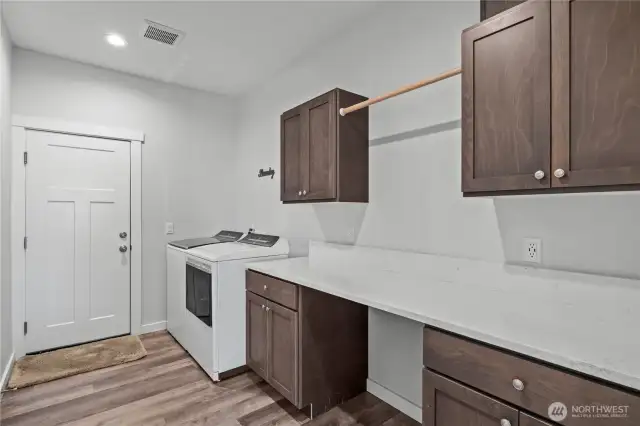 Massive laundry room will come in handy!  Love all the counter & cabinet space!