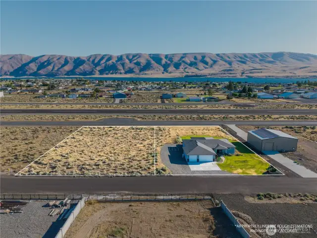 Land in back of the house goes almost to the  runway - plus the 1/2 acre lot to the left = All yours!