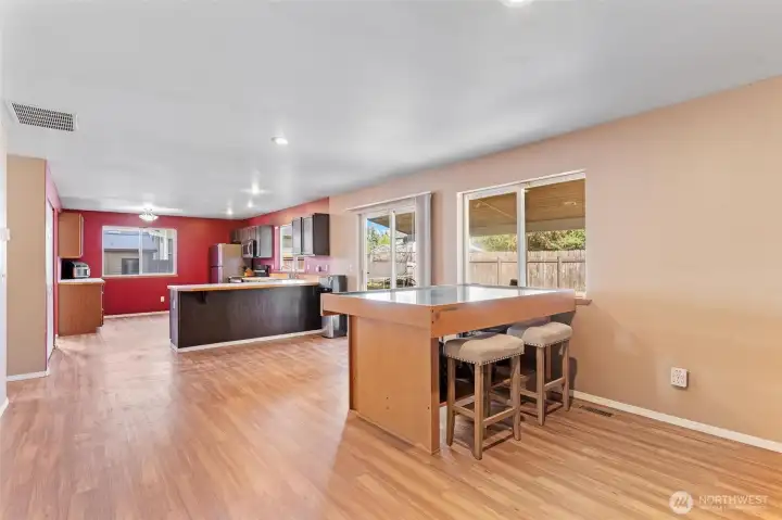 Large living room with gas fireplace and spacious kitchen