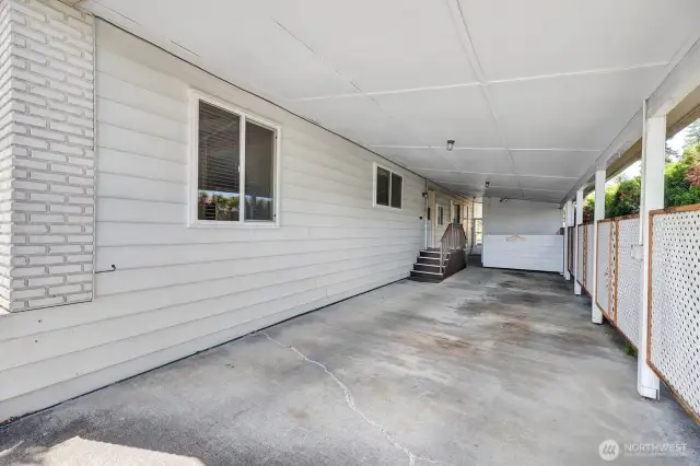 Oversized, private carport area. Double sided stairs to the utility room access door into the home. You are covered from the weather when unloading groceries etc.