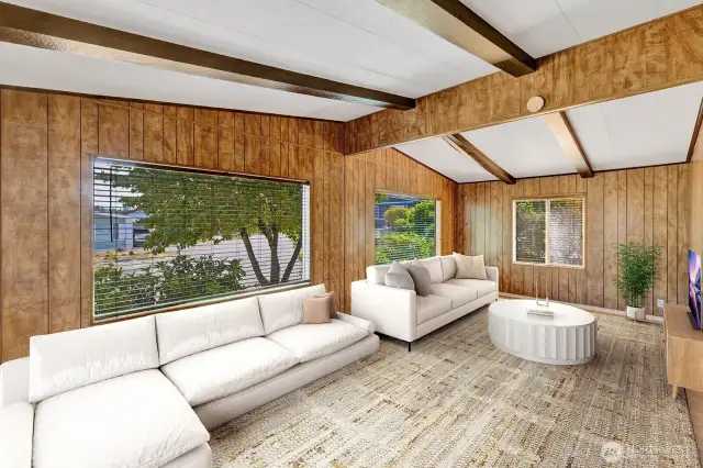 Family room has notable natural lighting. Custom plantation blinds on the vinyl windows. Great space for relaxing, or entertaining. Easy care laminate flooring for your convenience.