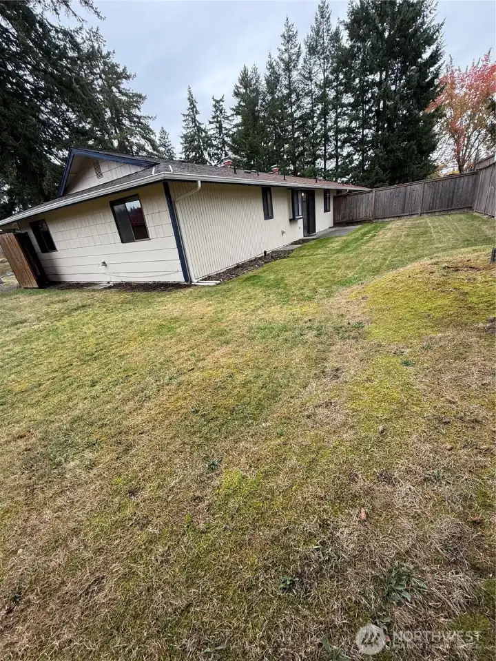 Large fenced back yard in the Rear of unit.