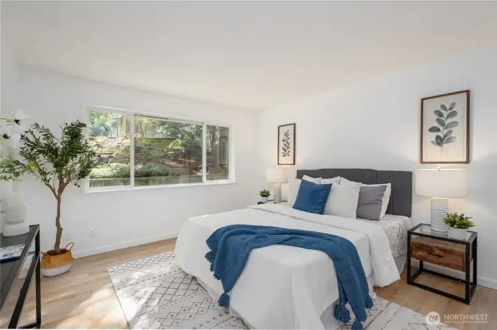 Primary bedroom is quite large and easily fits a king bed with side tables and has room left over.