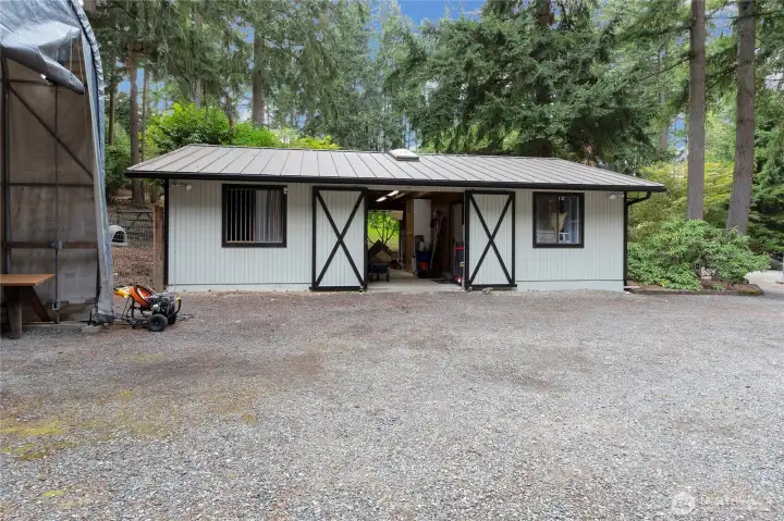 Barn building with a single stall and a workshop. Water and power to barn building.