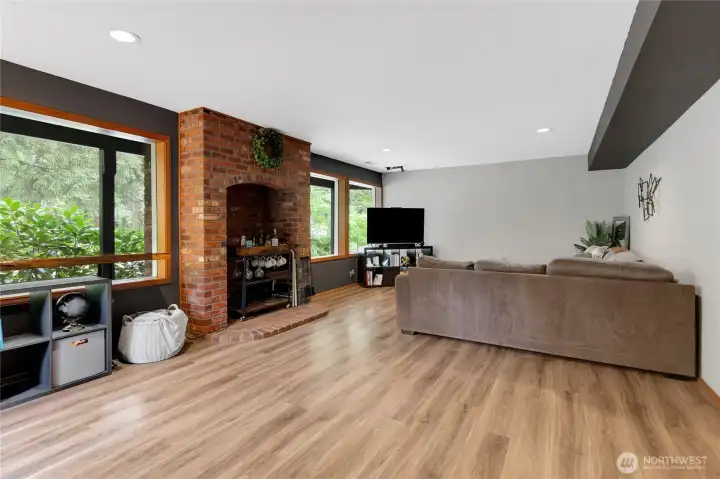 Basement Living Room with exterior access and windows facing the front.