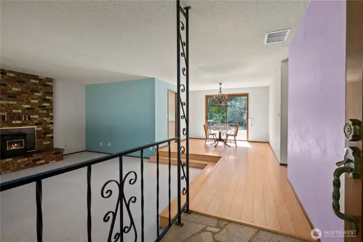 The entrance opens into a sunken living room, lovely engineered hardwood flooring.