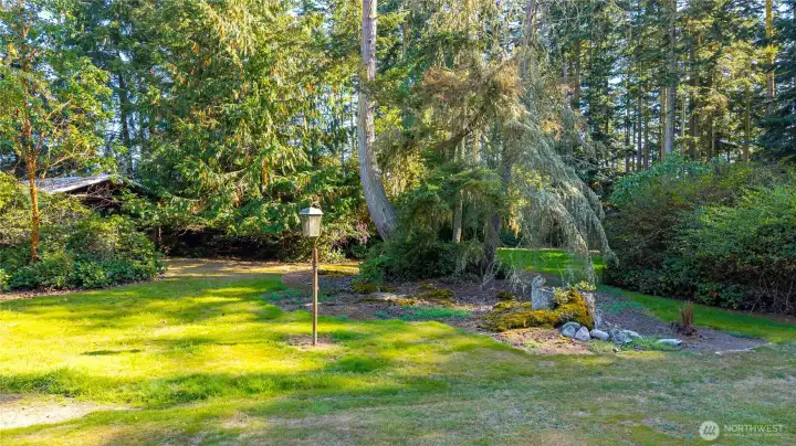The lovely variety of trees can be seen in this captivating picture. A third metal covered storage is seen to the left.