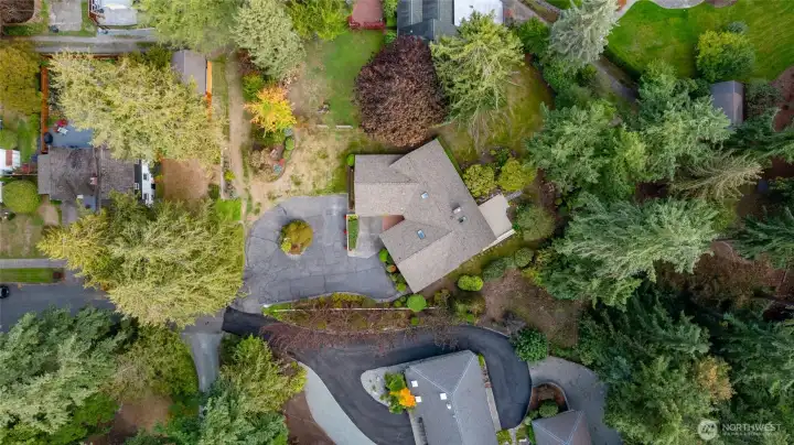 An overhead of the property (with the green island in the driveway) and surrounding gardens.
